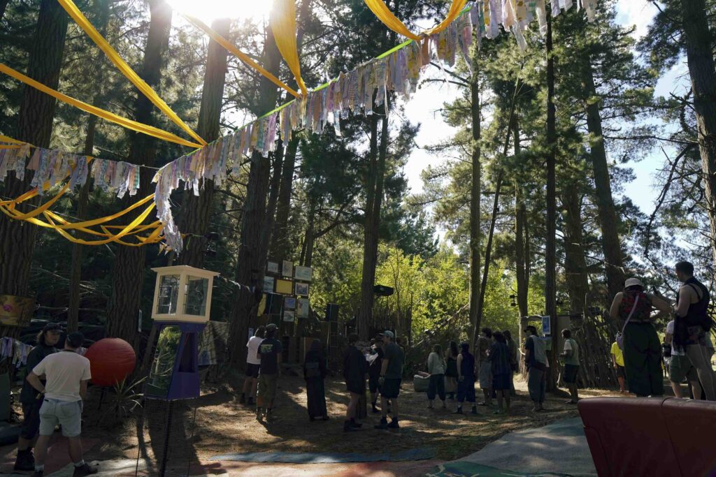 Wide angel shot of the ribbons going between the trees in the forest at TwoMinds 2026