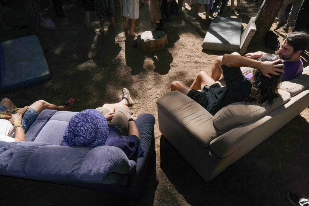 Group of people chilling out on the couches in the forest at TwoMinds 2026