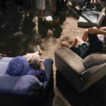 Group of people chilling out on the couches in the forest at TwoMinds 2026